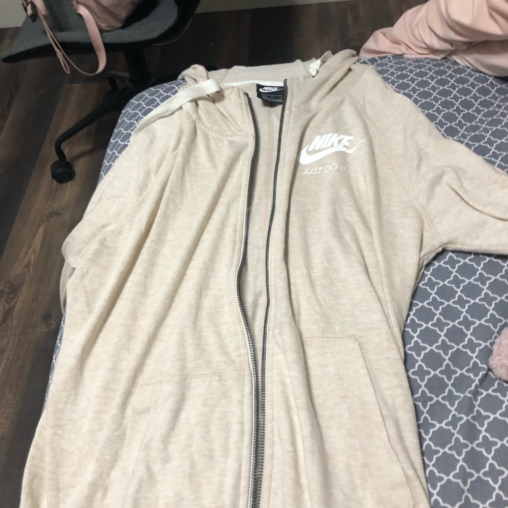 nike crème colored zip up hoodie size large